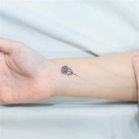 tattoo flower wrist|minimalist flower wrist tattoo.